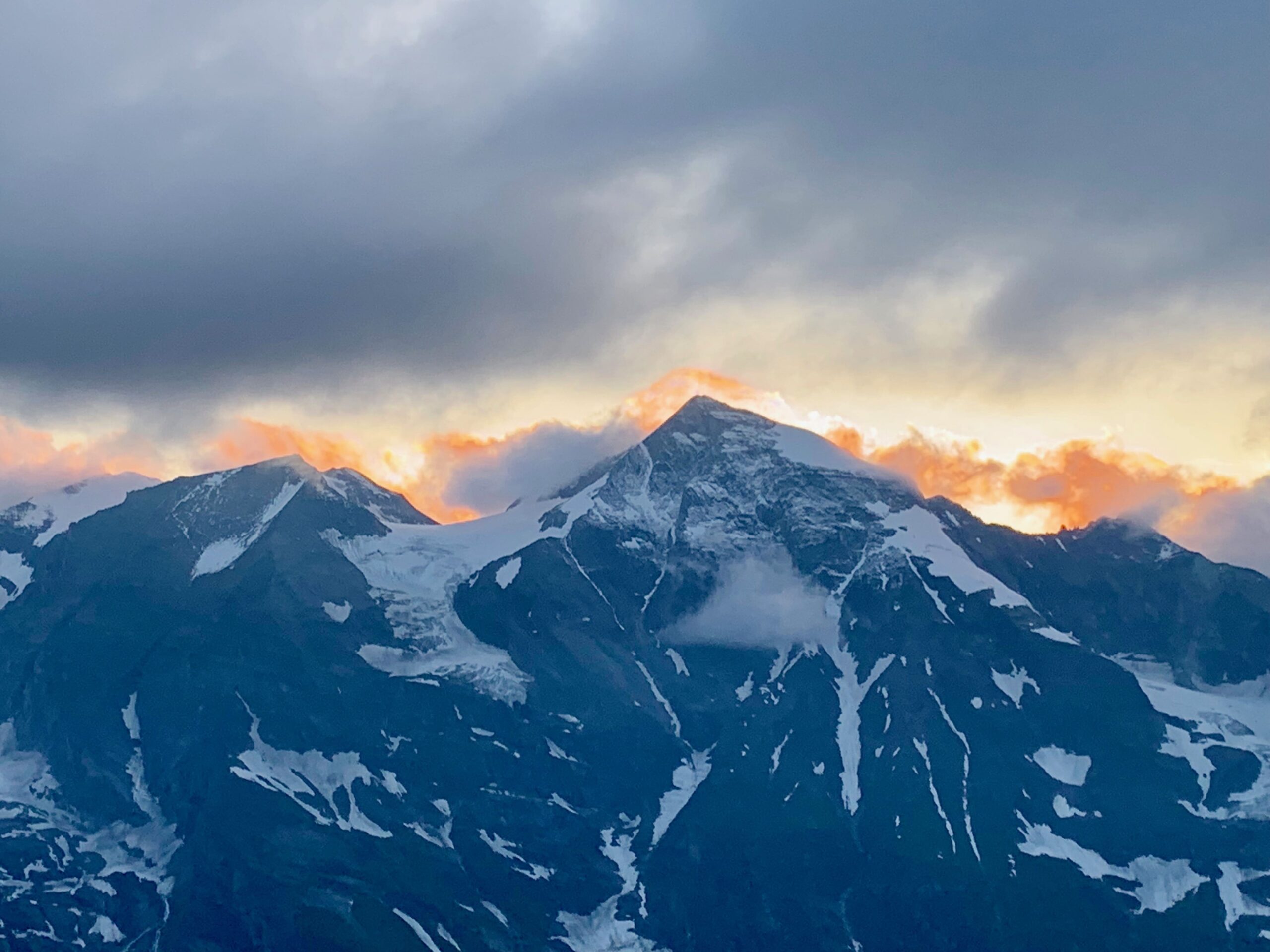 Sunrise in snow-capped mountains